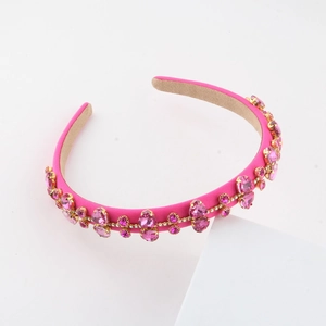 Fashionable pink rhinestone baroque headband with sparkling crystals and gold metal settings