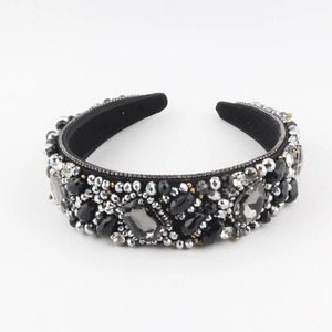 Macro detail of Baroque headband featuring large grey crystals and black beaded textures