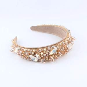 Detail of luxury padded headband with champagne crystals, pearls and golden bead chains
