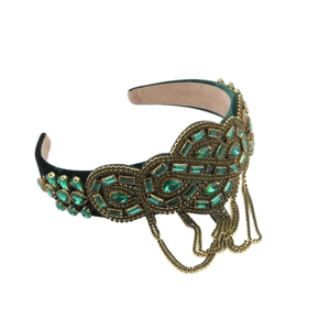 Serre-tête vintage en velours vert foncé avec cristaux émeraude et pompons dorés