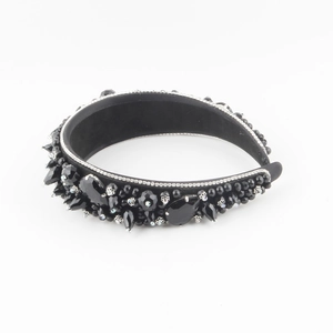 Close-up of vintage style black crystal headband with large teardrop stones and rhinestones