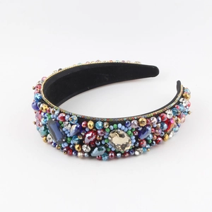 Close-up of Baroque velvet headband with multi-color beads and large crystals