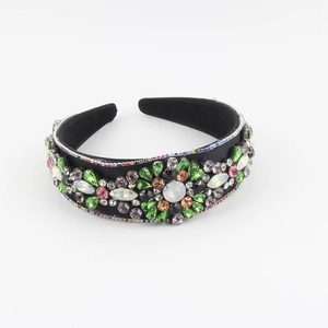 Baroque style wide headband with colorful rhinestones and emerald crystals on black fabric