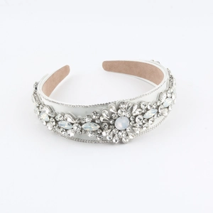 Luxurious padded headband with white satin, rhinestones, and pearly gems for women