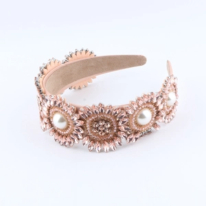 Serre-tête baroque rose champagne orné de cristaux de tournesol et de perles