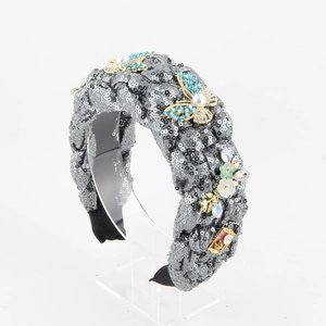 Detail of denim headband featuring blue rhinestone butterflies and faux pearls