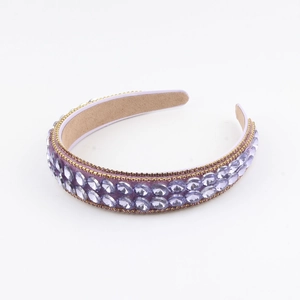 Baroque purple headband with double row crystals and gold chain on white background