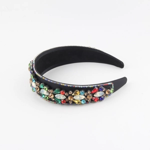 Close-up of vintage sponge headband with colorful rhinestones and premium jewels
