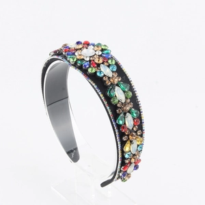 Detailed macro view of vibrant colorful rhinestones on a thick padded vintage headband