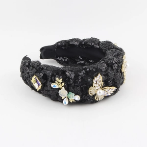 Denim headband with black sequins, pearls, and colorful rhinestones in a knot design
