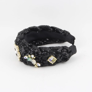 Detail of beaded denim knot headband with faux pearls and colorful rhinestones