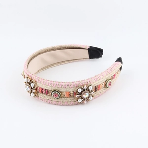 Detail of woven boho headband featuring pearls, rhinestones, and red gemstones