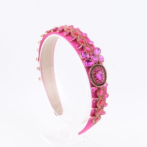Detail view of Baroque headband with pink rhinestones and magenta satin finish