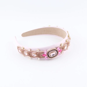 Macro detail of Baroque headband with pink rhinestones and handcrafted beadwork embroidery