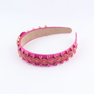 Detail of rose red baroque headband featuring crystal rhinestones and gold beading