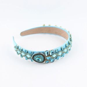 Macro detail of a baroque light blue headband with luxury rhinestones and crystal flower patterns