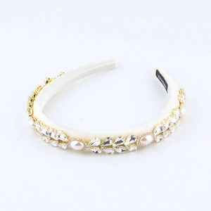 Elegant ivory satin headband featuring handcrafted crystals and pearls on a white background