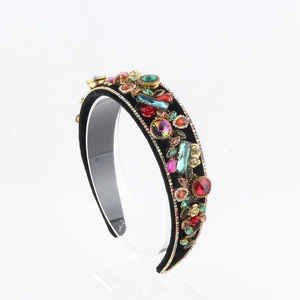 Detail view of Baroque headband with colorful crystals and gold metal ornaments