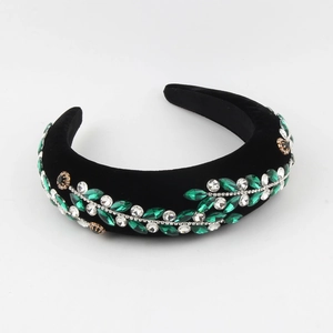 Serre-tête baroque rembourré avec strass verts et motif de feuilles sur velours