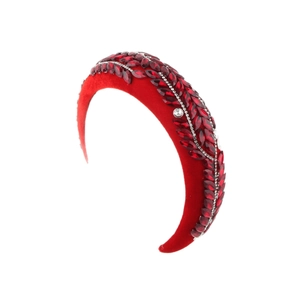 Vintage baroque red velvet headband with sparkling rhinestone leaf pattern on white background
