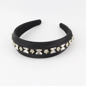 Elegant black padded headband featuring crystal butterfly and flower ornaments in satin fabric