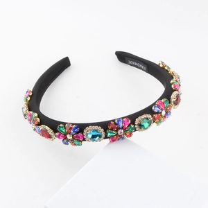 Detailed macro view of a handmade floral headband with vibrant colorful rhinestones