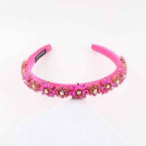 Detail of pink baroque headband featuring crystal flower patterns and handmade label