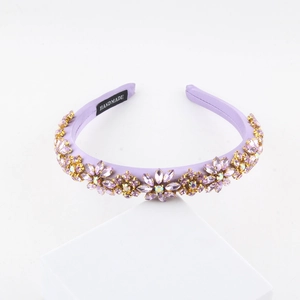 Detailed macro view of handmade lavender baroque headband with crystals and pearls