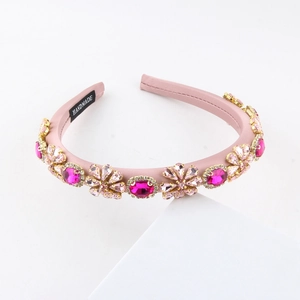 Detail of pink satin headband with handmade crystal flower and gemstone embellishments