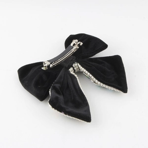 Elegant black velvet bow hair claw clip with rhinestones and metal spring grip for women