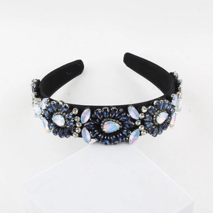 Detailed view of floral baroque headband with dark blue and iridescent crystals