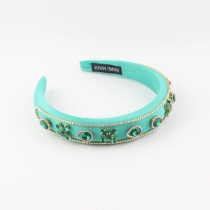 Green rhinestone headband with teardrop gems and long crystal fringe accents