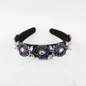 Detail of baroque headband featuring vintage floral patterns and shimmering rhinestones