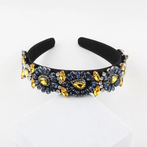 Detail view of baroque wide headband with blue and yellow crystal floral rhinestones