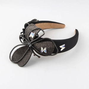Elegant black velvet headband with sparkling rhinestone butterfly design for women