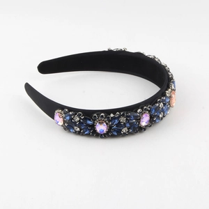 Detailed view of Baroque headband with blue crystals and white rhinestones on black