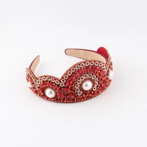 Luxury baroque headband with red rhinestones and white pearls on a white background