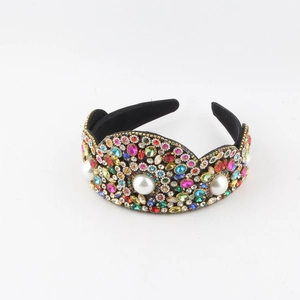 Detailed macro view of luxury padded headband with multicolored crystals and pearls
