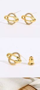 Detail view of 14K gold-plated paperclip earrings with cubic zirconia micro-inlay