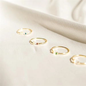 Adjustable gold rings with colorful birthstones and personalized alphabet charms A and B