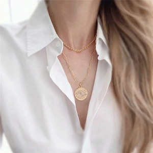 Double-layered 14K gold plated paperclip chain necklace with a crystal evil eye coin charm