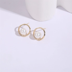 Elegant 925 silver needle pearl earrings with gold circular frames and zircon accents