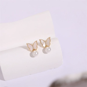 Elegant 14K gold butterfly earrings with zircon accents and white pearl drops