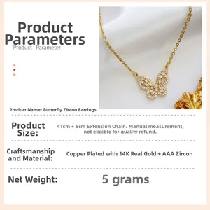 Detail of 14K gold plated butterfly necklace with AAA cubic zirconia on white fabric
