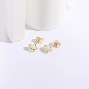Elegant gold Saturn stud earrings featuring iridescent opal stones on a white minimalist base