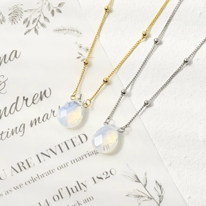 Minimalist gold and silver opal gemstone necklaces with faceted teardrop pendants