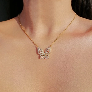 Elegant 14K gold plated butterfly pendant necklace with sparkling zircon on model's neck
