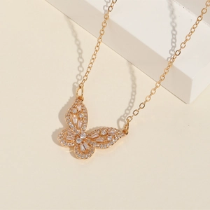 Exquisite 14K gold butterfly pendant necklace with zircon pavé on a minimalist base