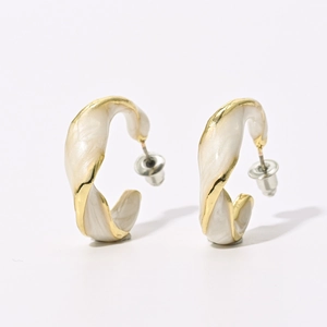 French vintage C-shaped twisted earrings with cream enamel finish and gold metal base