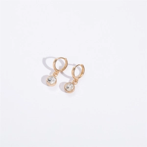Close-up of gold hoop earrings featuring a round zircon drop charm on white background